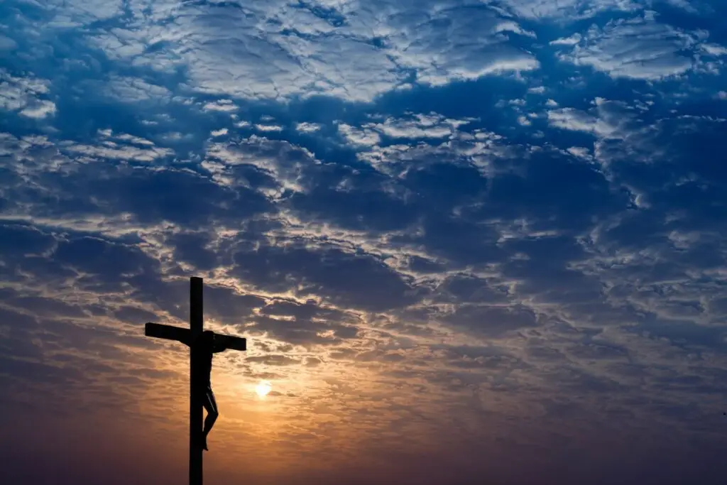 Image of Jesus on the cross as the sun sets representing the seven sayings from the cross.