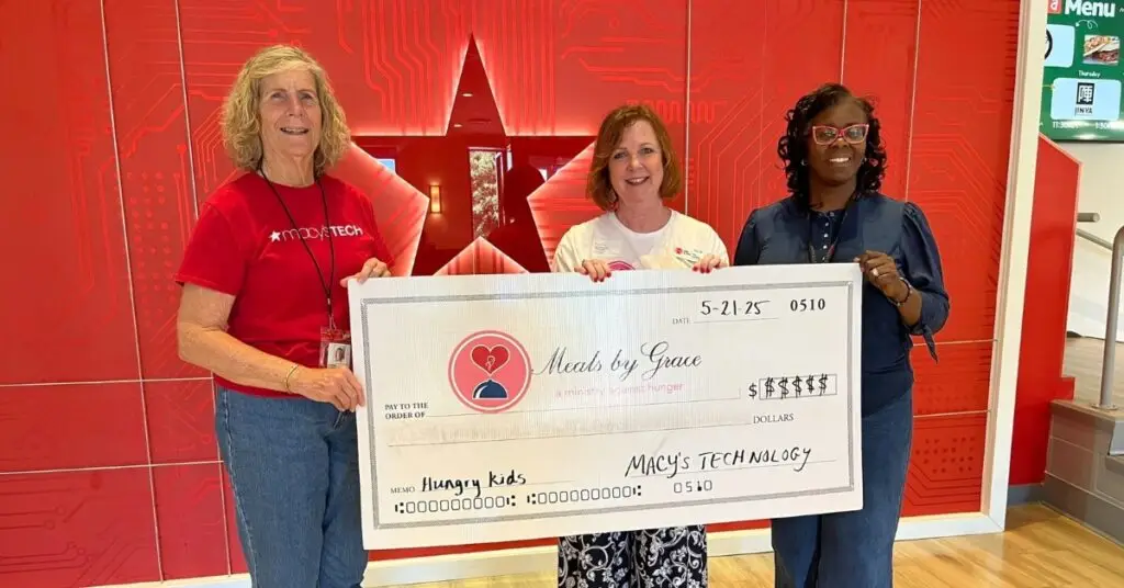 image of the Macy's Technology Department handing a big check to Meals By Grace after raising over $30,000 for the Meals By Grace Pantry.