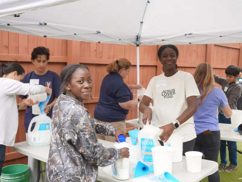 Image of a church volunteering at Ministries of Grace representing The Ultimate Guide to Nonprofit Partnerships for Churches.
