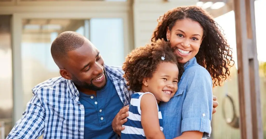 Image of a smiling family representing the end of year giving opportunities in GA at Ministries of Grace.