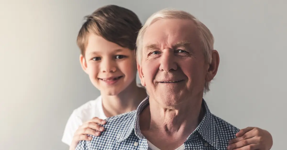 Image of a grandpa and grandson representing the power of end of year local giving in GA.