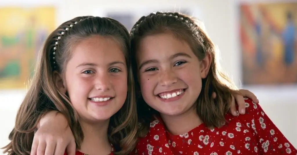 Image of two young sisters smiling representing What Every Dollar Does Real Impact From Real Gifts.